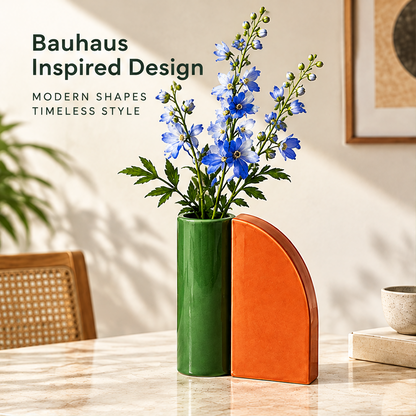 Green cylindrical vase and orange curved geometric form with blue flowers beside Bauhaus Inspired Design text