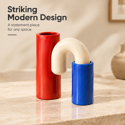 Red, blue and cream sculptural vase without flowers, beside Striking Modern Design text