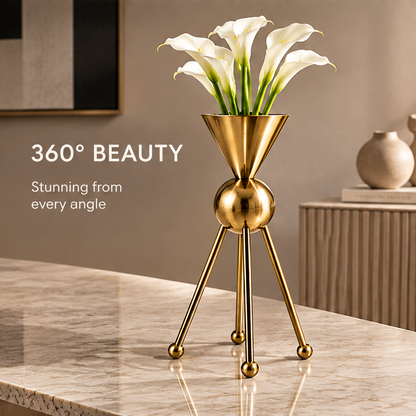 Alternate view of the gold-tone sculptural vase with rounded leg ends beside 360-degree beauty text
